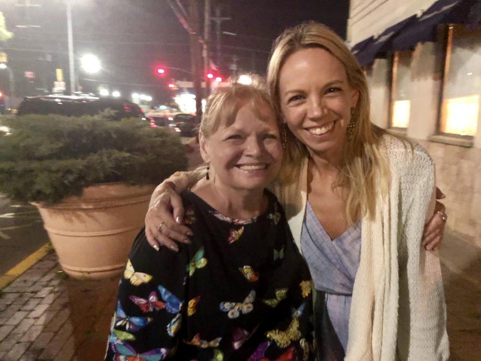 The author and her birth mother photographed after a large family dinner the night they first met in New York. Image courtesy of Marnie Goodfriend.