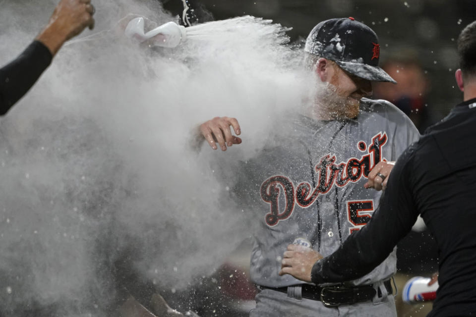 Detroit Tigers starting pitcher Spencer Turnbull (56) is showered with beer and powder by teammates after Turnbull threw a no-hitter in the team's baseball game against the Seattle Mariners, Tuesday, May 18, 2021, in Seattle. The Tigers won 5-0. (AP Photo/Ted S. Warren)
