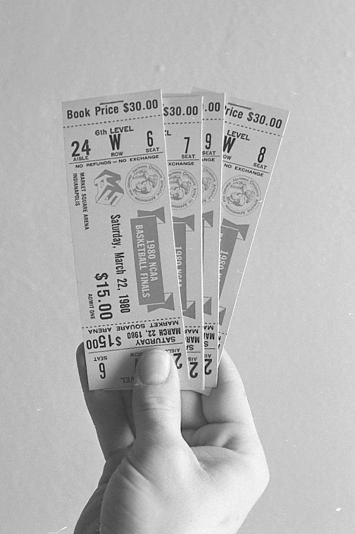 In this March 17, 1980, file photo, tickets to the NCAA Basketball Tournament Final Four at Market Square Arena in Indianapolis are held. Each ticket book cost $30, $15 per game.
(Credit: Journal & Courier Archives)