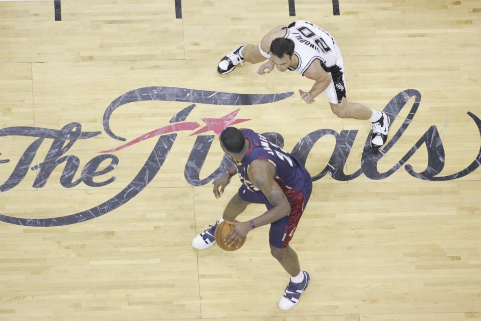 SAN ANTONIO - JUNE 7: LeBron James #23 of the Cleveland Cavaliers moves the ball against Manu Ginobili #20 of the San Antonio Spurs in Game One of the 2007 NBA Finals at The AT&amp;T Center on June 7, 2007 in San Antonio, Texas.&nbsp;