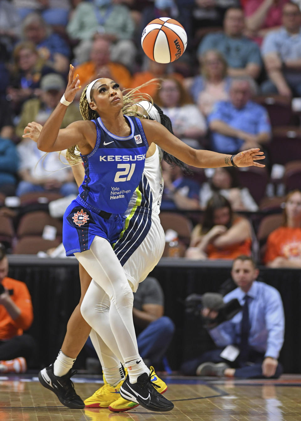 Connecticut Sun forward DiJonai Carrington (21) steals the ball from Dallas Wings guard Allisha Gray during a WNBA basketball game Tuesday, May 24, 2022, in Uncasville, Conn. (Sean D. Elliot/The Day via AP)