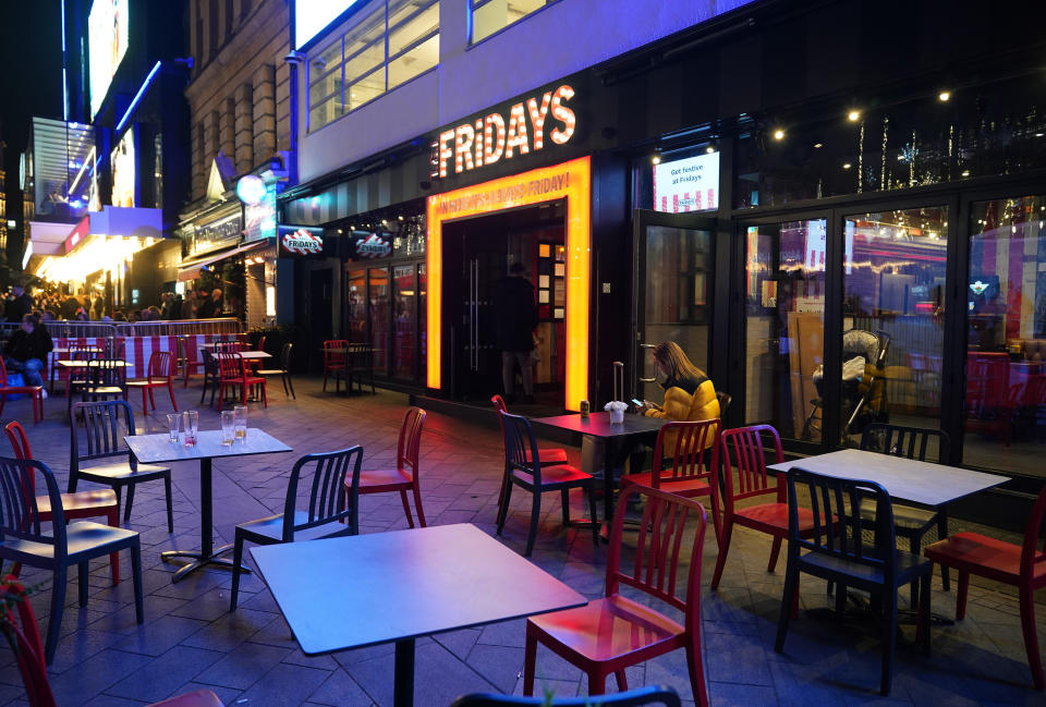 Empty tables outside a bar in Leicester Square, London, where new restrictions have come into force to slow the spread of the Omicron variant of coronavirus. Picture date: Wednesday December 15, 2021.