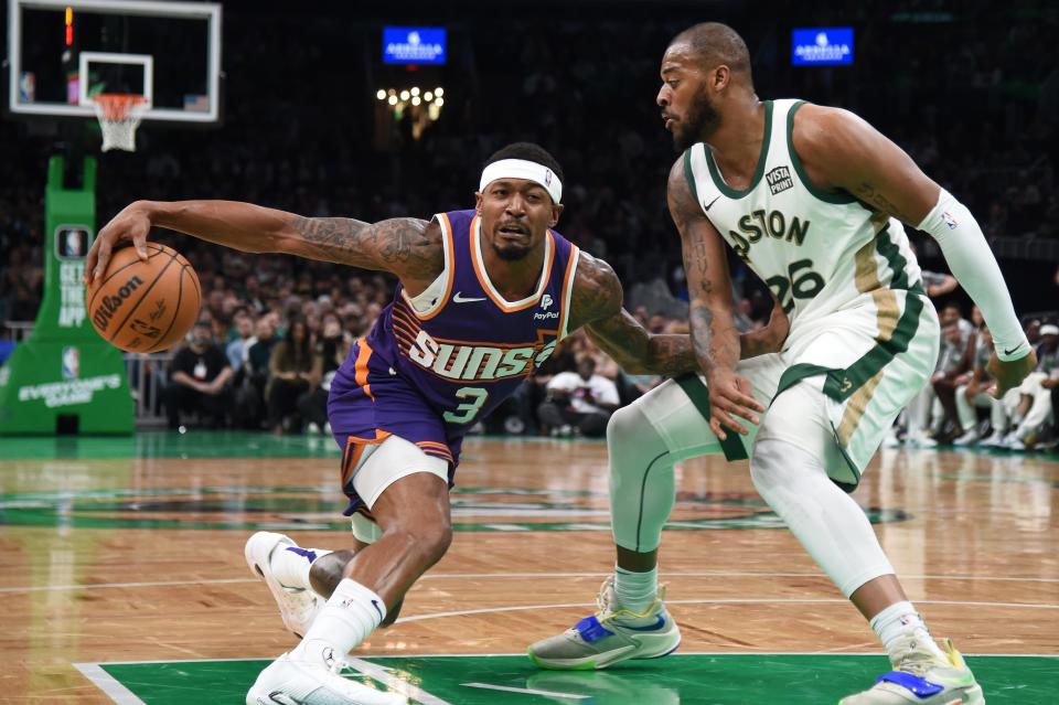 March 14: The Phoenix Suns' Bradley Beal (3) controls the ball while the Boston Celtics' Xavier Tillman (26) defends during the first half at TD Garden.