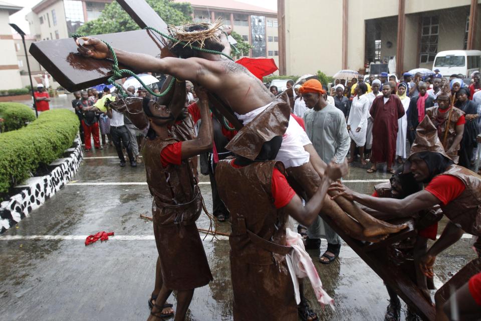 Catholic faithful perform the re-enactment of the death of Jesus Christ, on Good Friday in Lagos April 18, 2014.