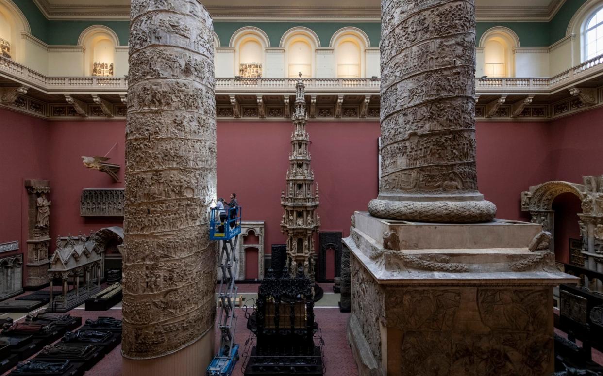 Conservators working on two halves of the replica Trajan’s Column in the V&A's Cast Courts - Geoff Pugh