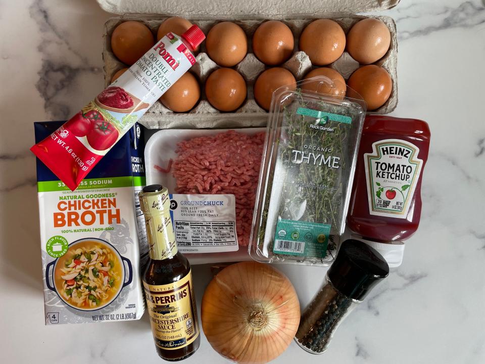 Ingredients for Ina Garten's meatloaf recipe laid on a marble surface.