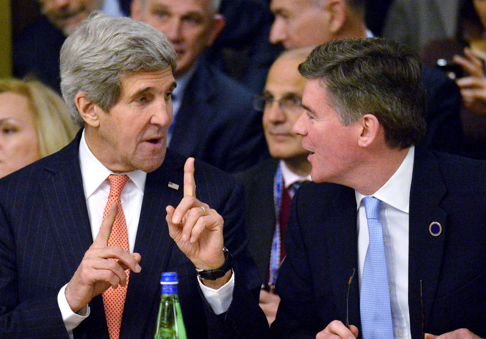 U.S. Secretary of State John Kerry (L) talks with British Junior Foreign Office minister Hugh Robertson during a meeting on Libya at the Foreign Ministry headquarters in Rome on March 6, 2014. Kerry meets with his counterparts from Italy, France and Germany in Rome to discuss the crisis in Ukraine. The talks are being held on the sidelines of an international meeting on Libya. (Photo credit should read ALBERTO PIZZOLI/AFP/Getty Images)