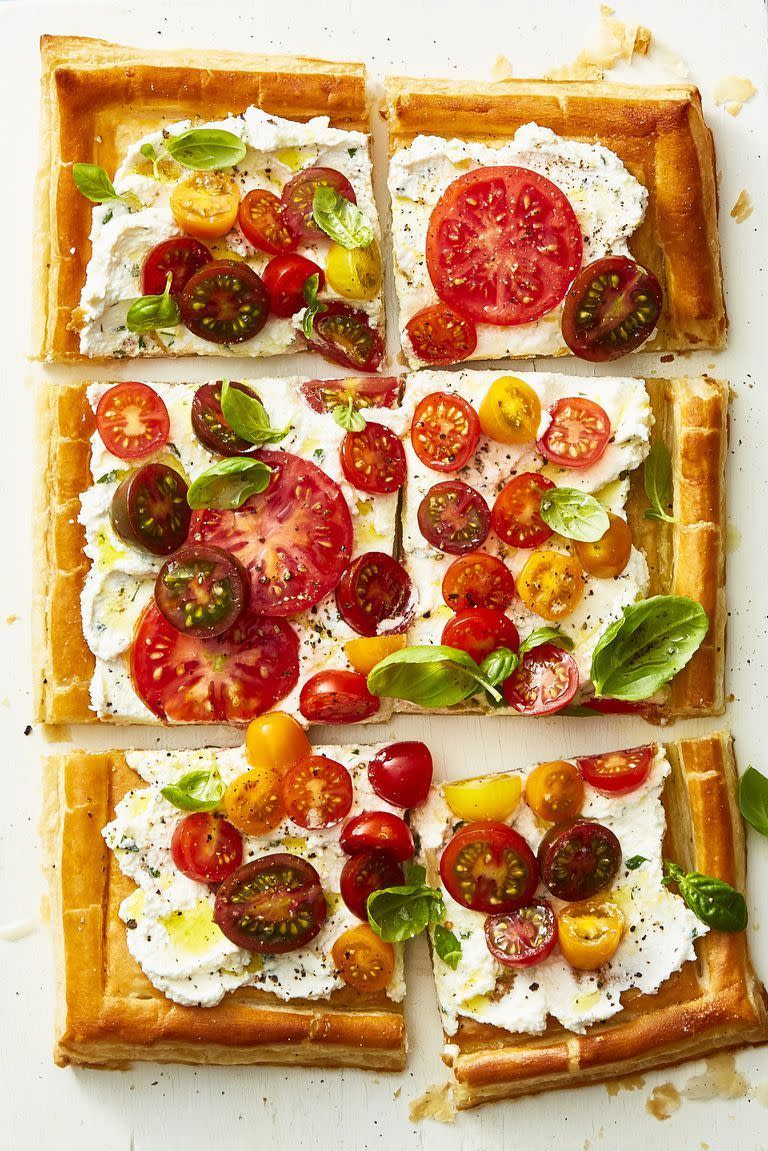 <p>Stick to tradition while highlighting the season's best with this fresh take on a pizza pie. It's seriously easy to make: Spread a layer of ricotta on frozen puff pastry before topping it with an array of tomatoes, herbs and other spices. </p><p><a href="https://www.goodhousekeeping.com/food-recipes/healthy/a22750354/herbed-ricotta-and-fresh-tomato-tart-recipe/" rel="nofollow noopener" target="_blank" data-ylk="slk:Get the recipe for Herbed Ricotta and Fresh Tomato Tart »;elm:context_link;itc:0;sec:content-canvas" class="link "><em>Get the recipe for Herbed Ricotta and Fresh Tomato Tart »</em></a></p>