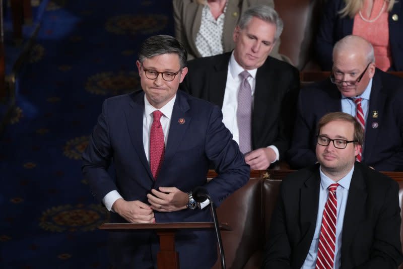 Rep. Mike Johnson, R-La., votes for himself as House speaker as former Speaker Kevin McCarthy, R-Calif., watches on October 25. File Photo by Pat Benic/UPI