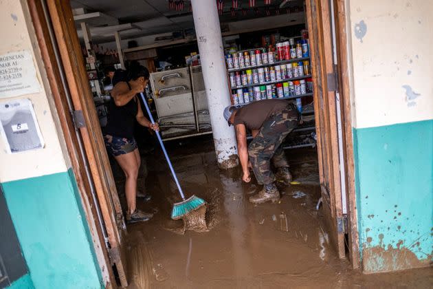 Employees remove mud from a hardware store in the aftermath of Hurricane Fiona in Salinas, Puerto Rico, on Monday. (Photo: Ricardo Arduengo/Reuters)