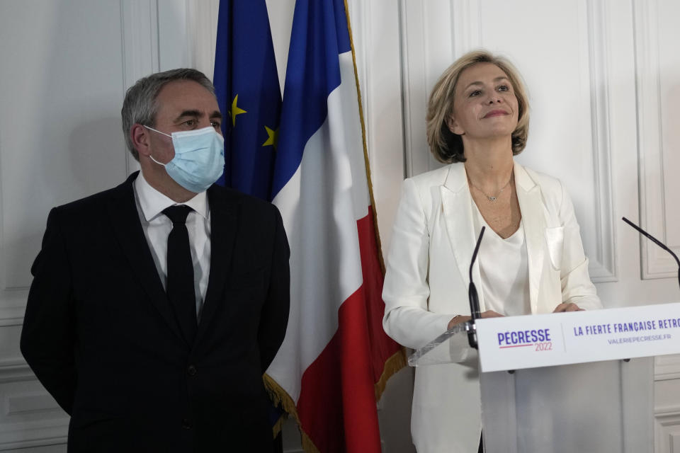 Valerie Pecresse speaks during a press conference at her campaign headquarters, with losing candidate Xavier Bertrand at her side, Thursday, Dec. 2, 2021 in Paris. Valerie Pecresse, a moderate conservative, will go into a runoff as the favorite to represent the conservative Les Republicains' candidate in the French presidential election in April. Valerie Pecresse will face Eric Ciotti, a right-winger in the party. (AP Photo/Christophe Ena)