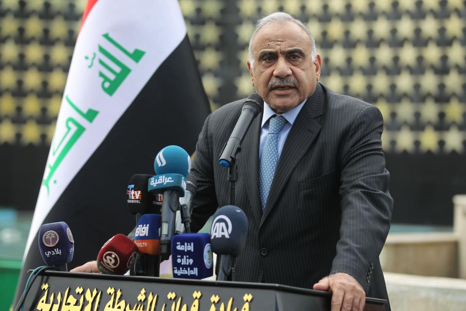 Iraqi Prime Minister Adel Abdul Mahdi speaks during a symbolic funeral ceremony in Baghdad on Oct. 23 for Maj. Gen. Ali al-Lami, a commander of the Iraqi Federal Police's Fourth Division, who was killed the previous day in Samarra in the province of Salahuddin, north of the Iraqi capital. He told parliament Sunday that the Iraqi government should begin scheduling the withdrawal of foreign troops from Iraq (Photo: AHMAD AL-RUBAYE via Getty Images)