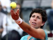 Carla Suarez Navarro of Spain serves to Simona Halep of Romania during their women's semi-final match at the Rome Open tennis tournament in Rome, Italy, May 16, 2015. REUTERS/Stefano Rellandini