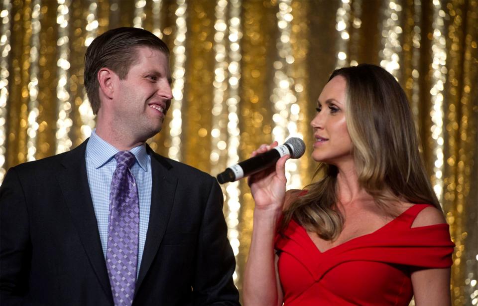 Lara Trump, next to Eric, speaks at a gala in Mar-a-Lago in 2018.