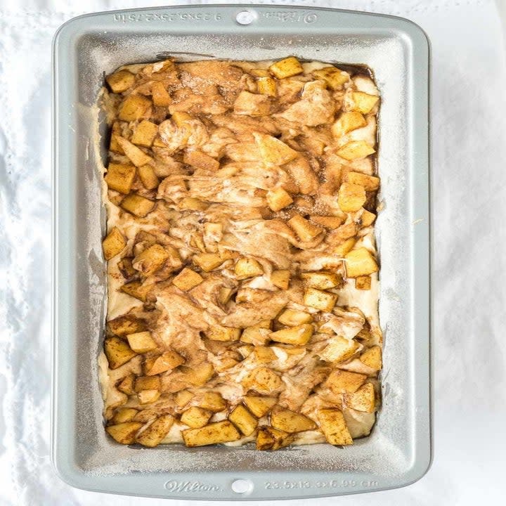 An apple cinnamon cake in a loaf pan.