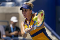 Belinda Bencic, of Switzerland, returns a shot to Emma Raducanu, of Great Britain, during the quarterfinals of the US Open tennis championships, Wednesday, Sept. 8, 2021, in New York. (AP Photo/Elise Amendola)