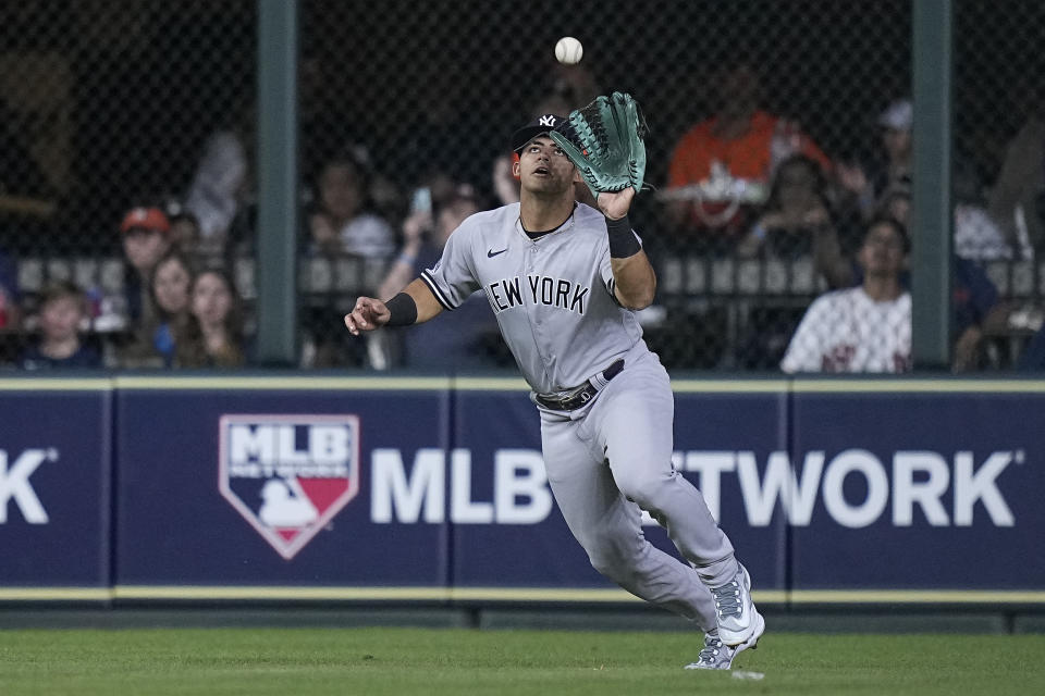 New York Yankees center fielder Jasson Dominguez catches a fly ball hit by Houston Astros' Jake Meyers during the second inning of a baseball game Friday, Sept. 1, 2023, in Houston. (AP Photo/Kevin M. Cox)