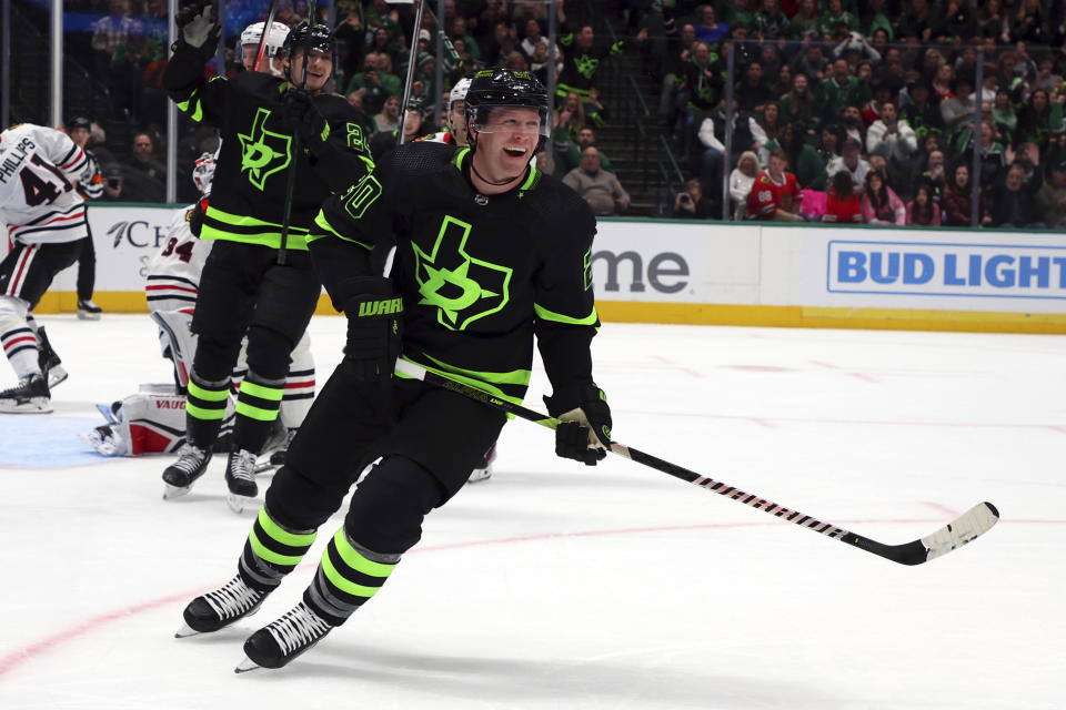 Dallas Stars defenseman Ryan Suter (20) celebrates after scoring against the Chicago Blackhawks in the first period of an NHL hockey game Sunday, Dec. 31, 2023, in Dallas. (AP Photo/Richard W. Rodriguez)