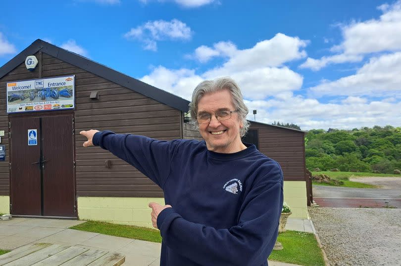 Martin Maddison pointing over at the TMC store