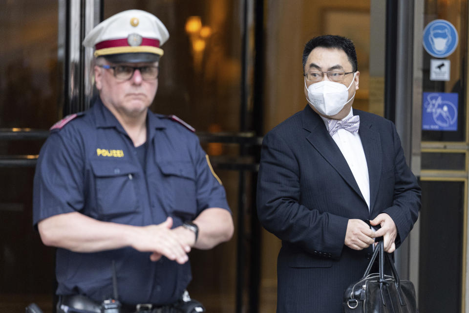 The ambassador of the Permanent Mission of the People's Republic of China to the United Nations, Wang Qun, leaves the 'Grand Hotel Vienna' where where closed-door nuclear talks take place in Vienna, Austria, Saturday, June 12, 2021. (AP Photo/Florian Schroetter)