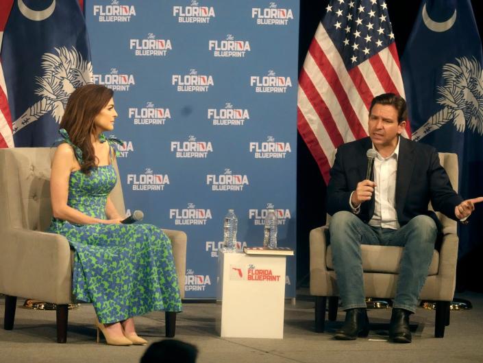 Casey DeSantis, left, looks on as her husband, Florida Gov. Ron DeSantis, speaks to a crowd at First Baptist North on Wednesday, April 19, 2023, in Spartanburg, South Carolina.