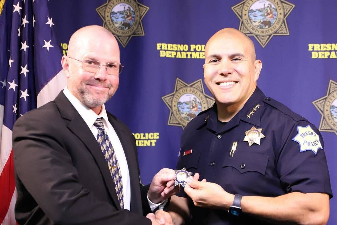 Paige McQuay, left, is seen with former Fresno Police Chief Paco Balderrama when McQuay was promoted to sergeant in a photo posted to the department’s Facebook page on April 7, 2023.