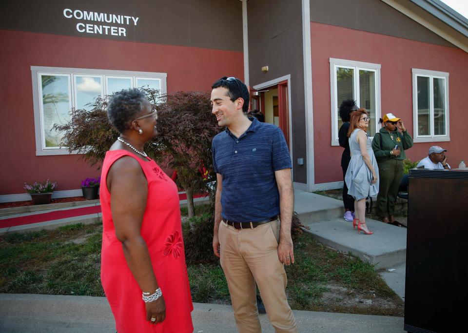 Des Moines school board member Teree Caldwell-Johnson, who is also the CEO of Oakridge Neighborhood, speaks with Des Moines councilman Josh Mandelbaum during the National Night Out in the Oakridge Neighborhood in Des Moines on Tuesday, Aug. 6, 2019.