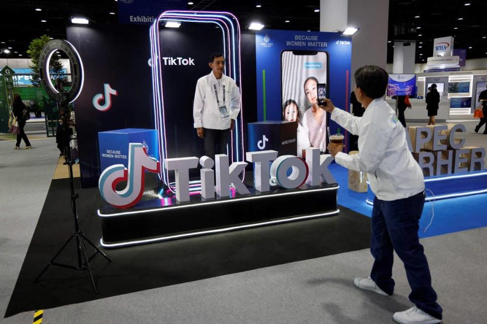 A man poses at the TikTok booth at the international media centre during the Asia-Pacific Economic Cooperation (APEC) summit in Bangkok on November 18, 2022.