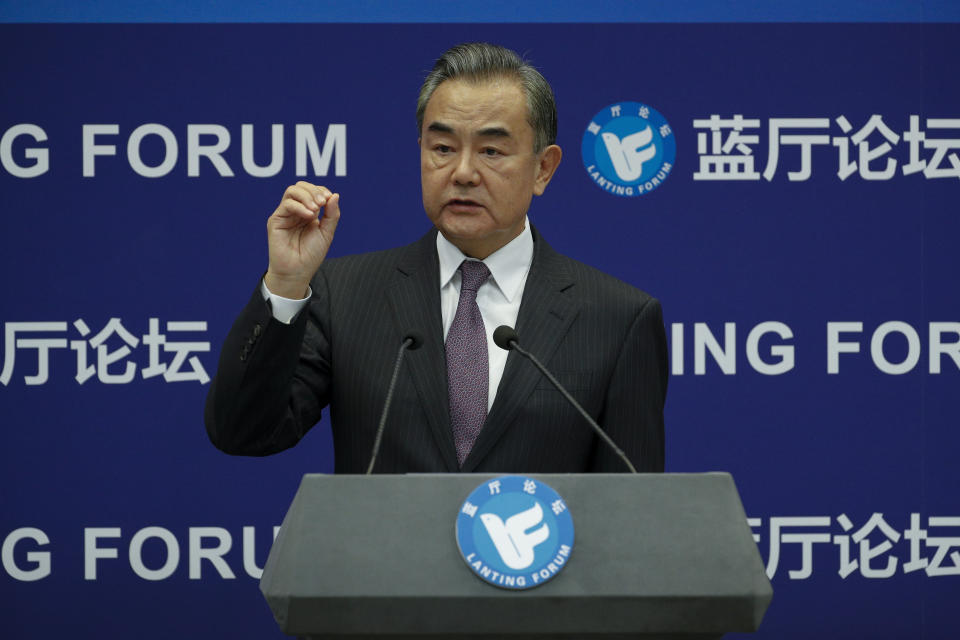 Chinese Foreign Minister Wang Yi gestures as he speaks during the Lanting Forum on the International Order and Global Governance in the Post COVID-19 Era held at the Ministry of Foreign Affairs office in Beijing, Monday, Sept. 28, 2020. Even though the spread of COVID-19 has been all but eradicated in China, the pandemic is still surging across the globe with ever rising death toll. (AP Photo/Andy Wong)