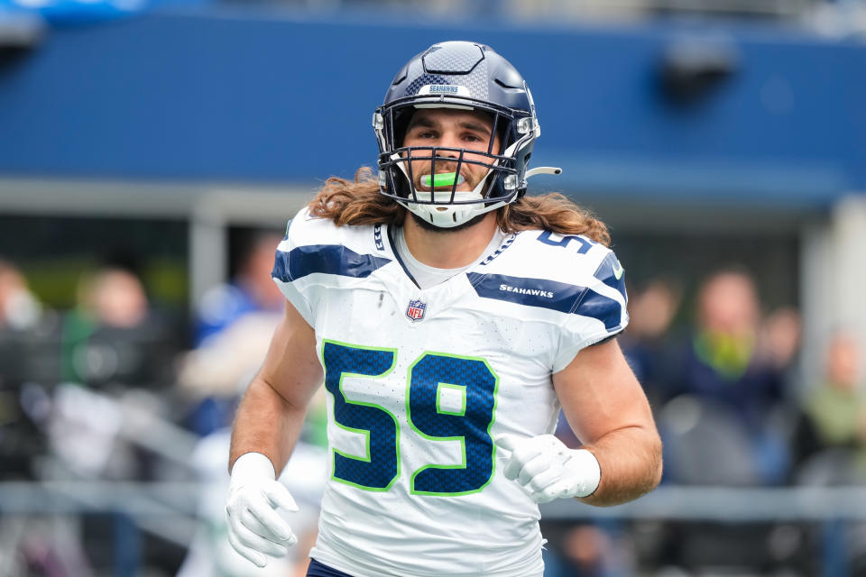 SEATTLE, WASHINGTON - SEPTEMBER 24: John Rhattigan #59 of the Seattle Seahawks runs back down the sideline after the kickoff during the first half of the game against the Carolina Panthers at Lumen Field on September 24, 2023 in Seattle, Washington.  (Photo by Christopher Mast/Getty Images)