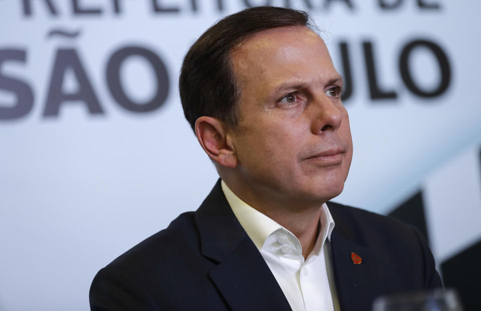 FILE - In this Oct. 25, 2017, file photo, Sao Paulo Mayor Joao Doria looks on during a news conference, after inspecting the Interlagos racetrack in Sao Paulo, Brazil. “We’re fighting against the coronavirus and against the ‘Bolsonarovirus,’” Doria said in an interview with The Associated Press on Wednesday, April 15, 2020, adding that the president has adopted “incorrect, irresponsible positions” and ignored health authorities’ recommendations by glad-handing with supporters in the streets. (AP Photo/Andre Penner, File)