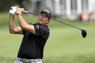 Phil Mickelson tees off from the third hole during the first round of the Travelers Championship golf tournament at TPC River Highlands, Thursday, June 25, 2020, in Cromwell, Conn. (AP Photo/Frank Franklin II)