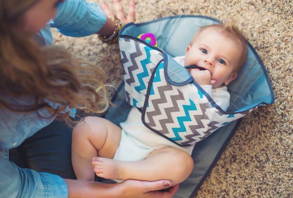 The SnoofyBee Portable Clean Hands Changing Pad keeps your tot clean and still while you put in the work. (Photo: Walmart)