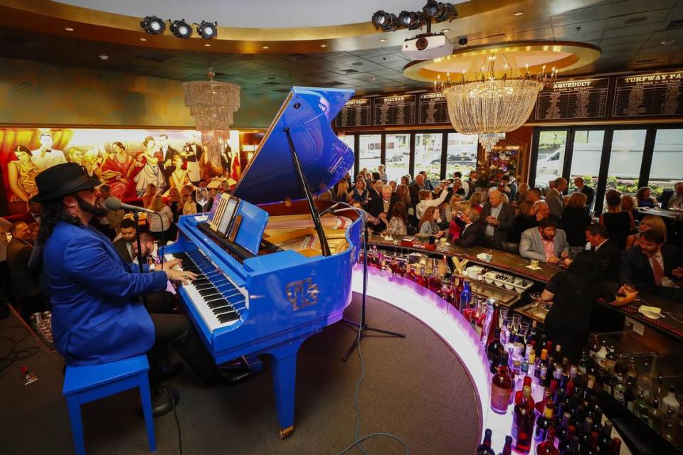 Jamie Higdon, of Nashville, performed behind the bar during a ribbon cutting ceremony and dry run for the new Jeff Ruby’s Steakhouse at City Center in downtown Lexington in 2019.