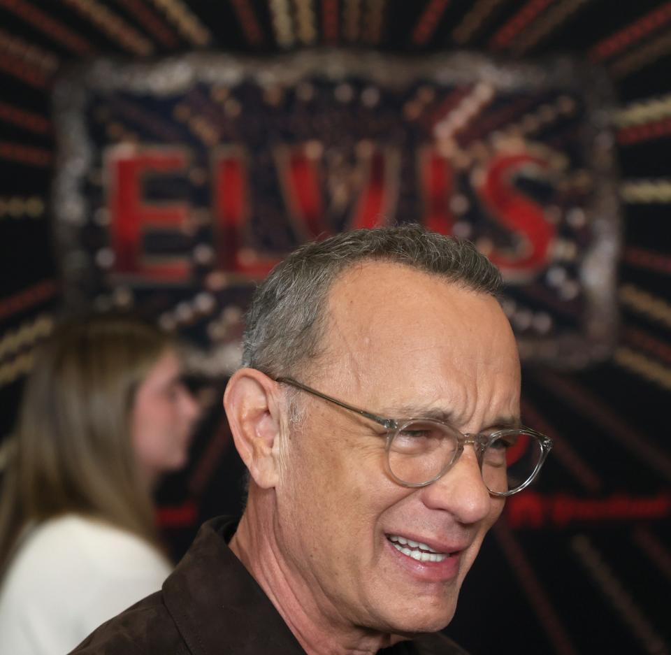 Tom Hanks greets the press during a red carpet event before the screening for the new biopic movie 'Elvis' at Graceland in Memphis, Tenn. on Saturday, June 11, 2022. 