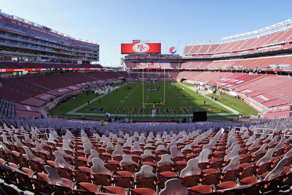 This Oct. 4, 2020, file photo, taken with a fisheye lens, shows an empty Levi's Stadium before an NFL football game between the San Francisco 49ers and the Philadelphia Eagles in Santa Clara, Calif. The 49ers and other teams may need to find a temporary new home after Santa Clara County on Saturday, Nov. 28, 2020, banned all contact sports from holding games and practices for the next three weeks. County officials issued the directives in response to rising cases of the coronavirus in the area. The rules take effect Monday and will last for three weeks. (AP Photo/Tony Avelar, File)