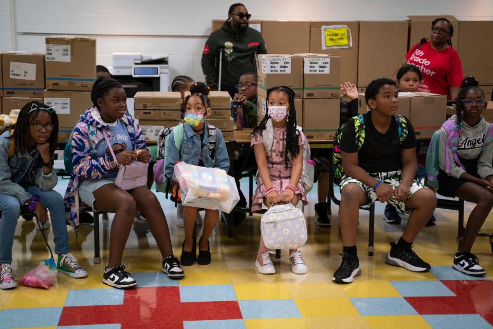 Fifth grade students sit down for a discussion before going to their classrooms during the first day of school at Eisenhower Elementary School in Southfield on Monday, Aug. 28, 2023.