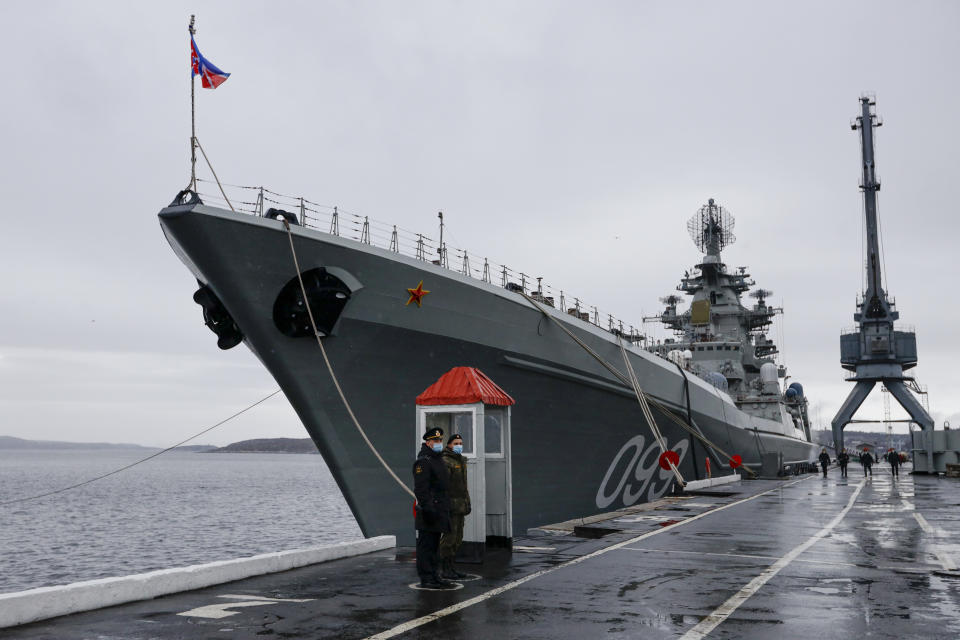 Russian sailors stand guard at the Northern Fleet's flagship, the Pyotr Veilikiy (Peter the Great) missile cruiser, at its Arctic base of Severomorsk, Russia, Thursday, May 13, 2021. Adm. Alexander Moiseyev, the commander of Russia's Northern Fleet griped Thursday about increased NATO's military activities near the country's borders, describing them as a threat to regional security. (AP Photo/Alexander Zemlianichenko)