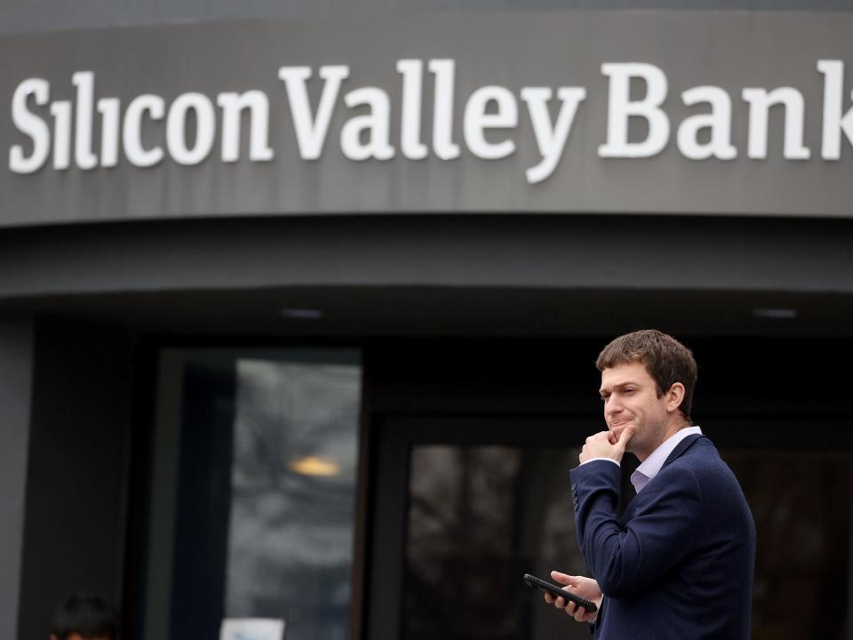 A man stands outside Silicon Valley Bank