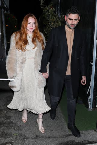 <p>Perception/Bauer-Griffin/GC Images</p> Lindsay Lohan and Bader Shammas step out for a dinner date on March 16, 2024