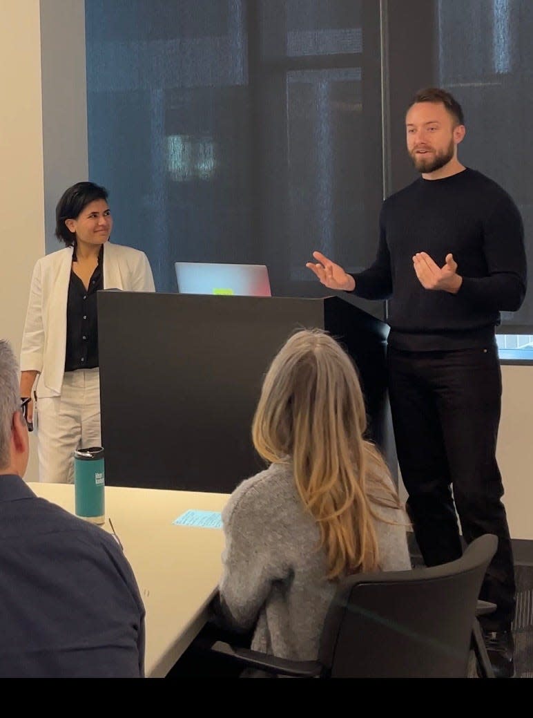 Brandon Fluegel giving a presentation after being recognized for his award by Amazon.