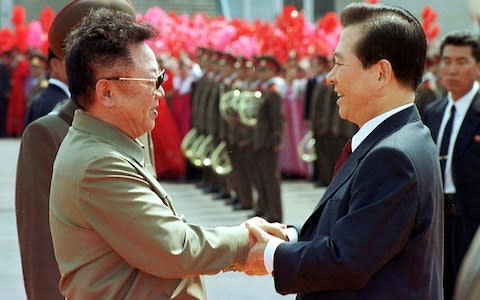 Former North Korean leader Kim Jong Il, left, and then South Korean President Kim Dae-jung met in Pyongyang in 2000