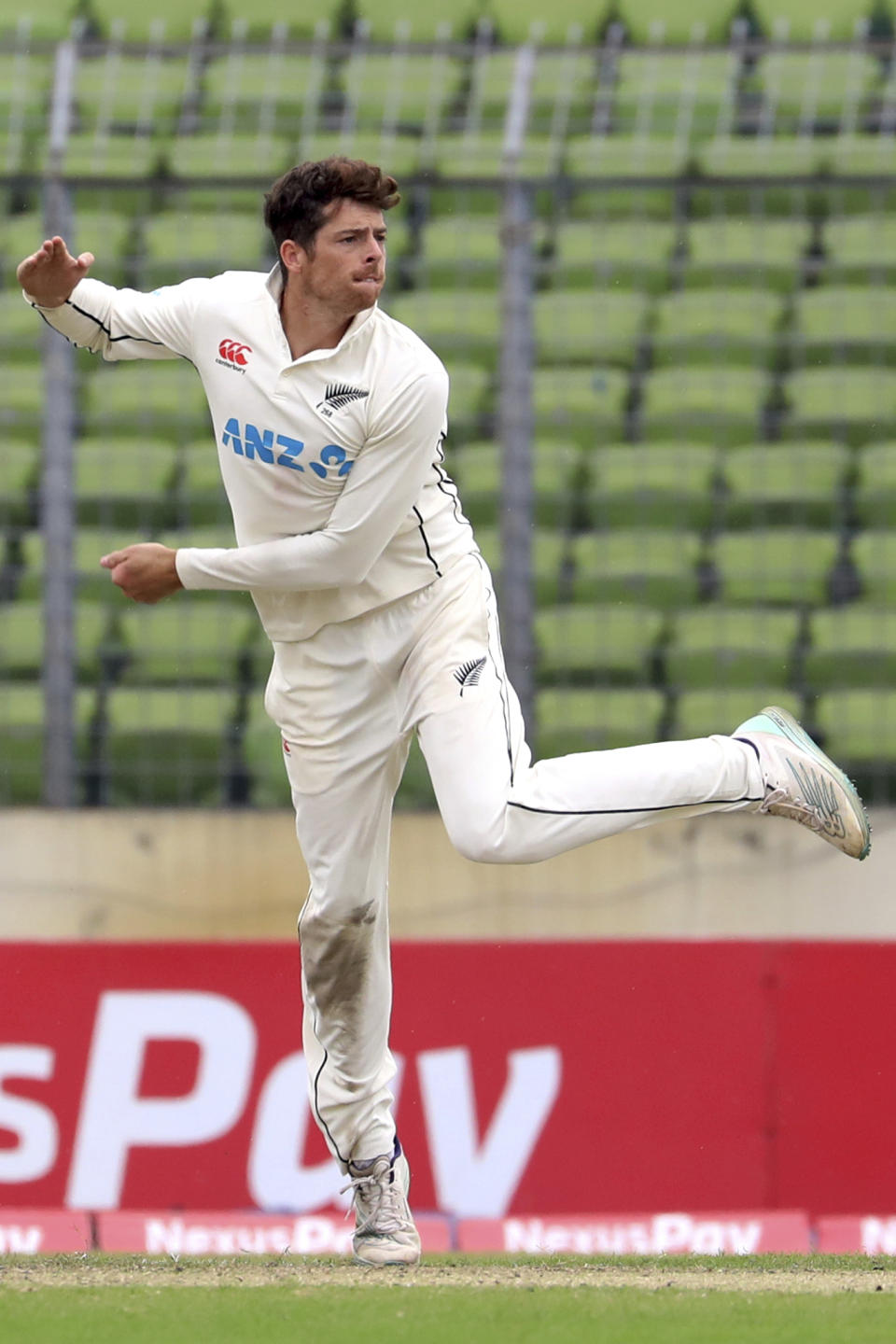 New Zealand's Mitchell Santner bowls during the first day of the second test cricket match between Bangladesh and New Zealand in Dhaka, Bangladesh, Wednesday, Dec.6, 2023. (AP Photo/Mosaraf Hossain)