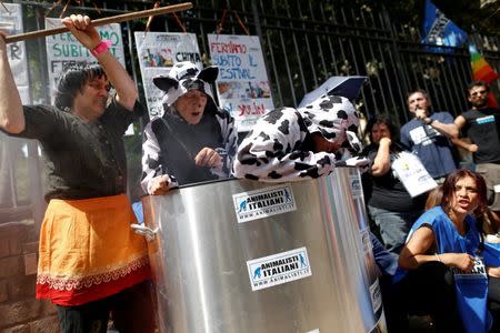 Animal activists protest against Yulin Dog Meat Festival in front of the Chinese embassy in Rome, Italy June 21, 2016. REUTERS/Tony Gentile