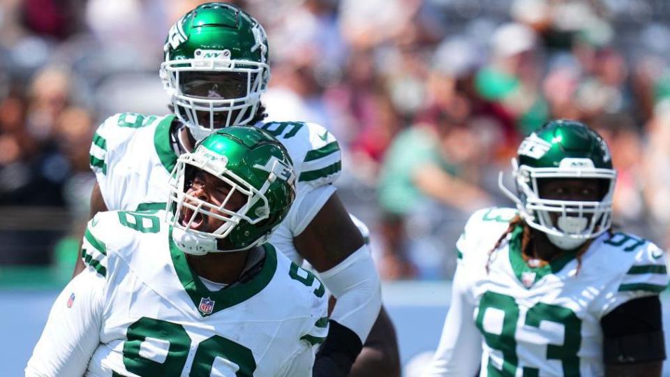 New York Jets players celebrate during a pre-season game