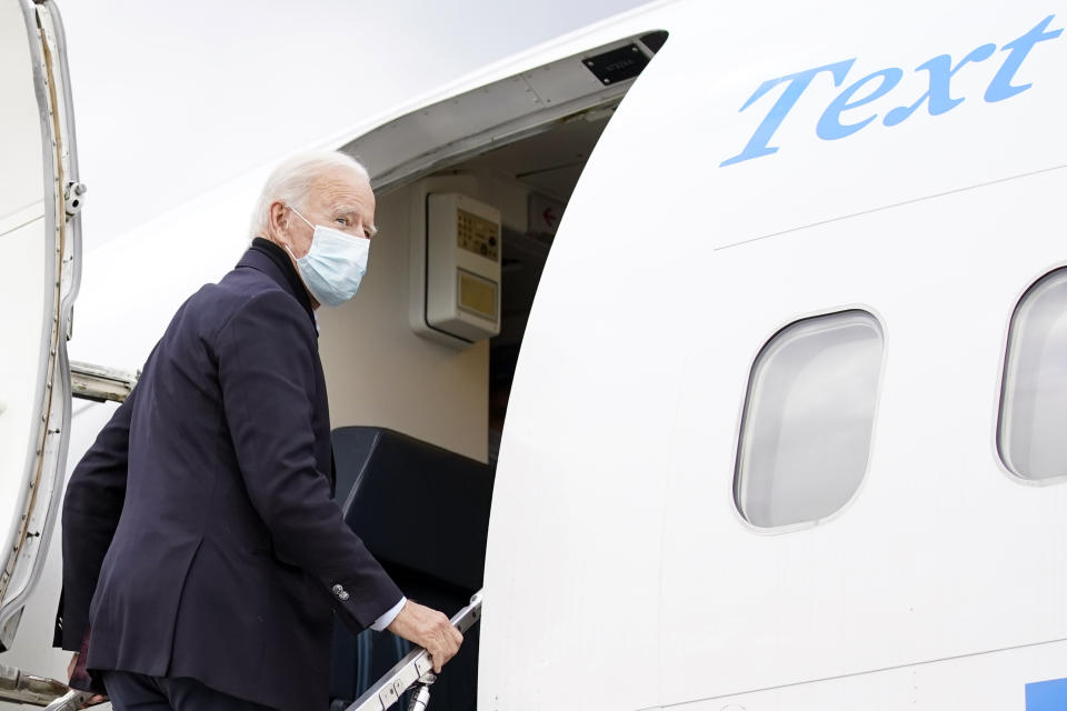 Democratic presidential candidate former Vice President Joe Biden boards his campaign plane at Gerald R. Ford International Airport in Grand Rapids, Mich., Friday, Oct. 2, 2020, to travel to New Castle Airport in New Castle, Del. after speaking at United Food & Commercial Workers Union Local 951. (AP Photo/Andrew Harnik)