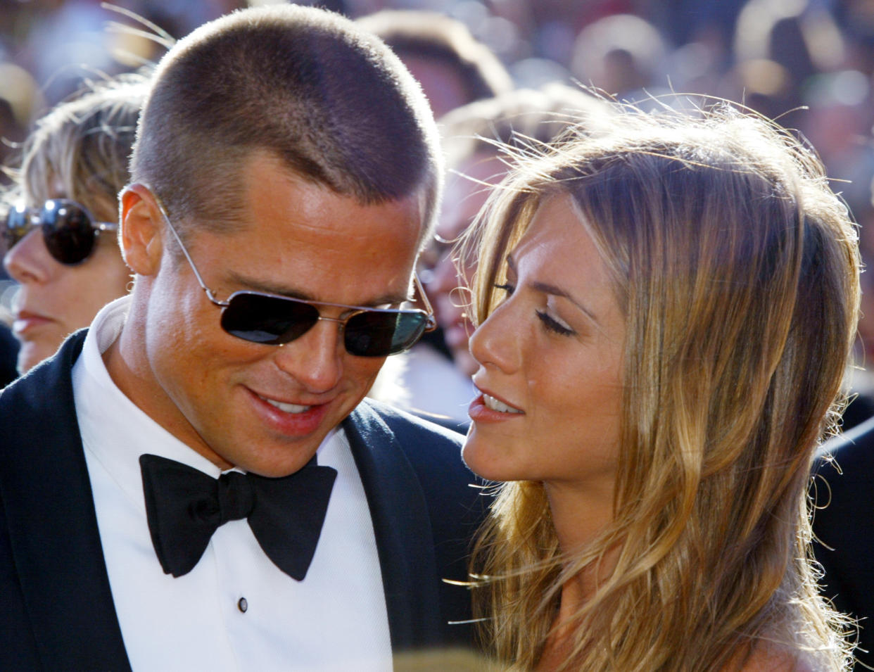 Brad Pitt and Jennifer Aniston arrive at the 56th annual Primetime Emmy Awards at the Shrine Auditorium in Los Angeles, in this September 19, 2004 file photo. Jennifer Aniston filed for divorce on March 25, 2005 from Brad Pitt, some two and a half months after Hollywood's golden couple announced they were separating, court papers in Los Angeles showed. REUTERS/Kimberly White/Files  SV/PN