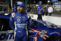 Kyle Larson stands by his car on pit road after qualifying for the NASCAR Daytona 500 auto race at Daytona International Speedway, Wednesday, Feb. 15, 2023, in Daytona Beach, Fla. (AP Photo/John Raoux)