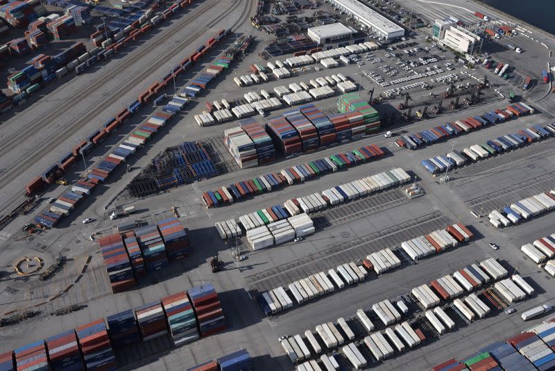 FILE PHOTO: Shipping containers sit on the dock at a container terminal at the Port of Long Beach-Port of Los Angeles complex, amid the coronavirus disease (COVID-19) pandemic, in Los Angeles