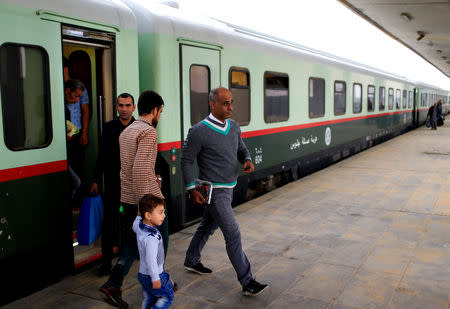Passengers get off a train coming from Baghdad, as it arrives in Fallujah, the newly resurrected service to the city, in Fallujah, Iraq November 7, 2018. Picture taken November 7, 2018. REUTERS/Thaier al-Sudani
